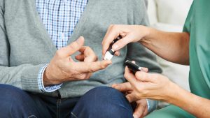 Man getting diabetes sugar level blood test